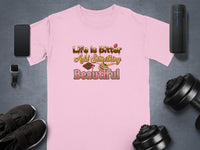 Pink t-shirt with "Life is Bitter Add Something Beautiful" text and dessert graphics.