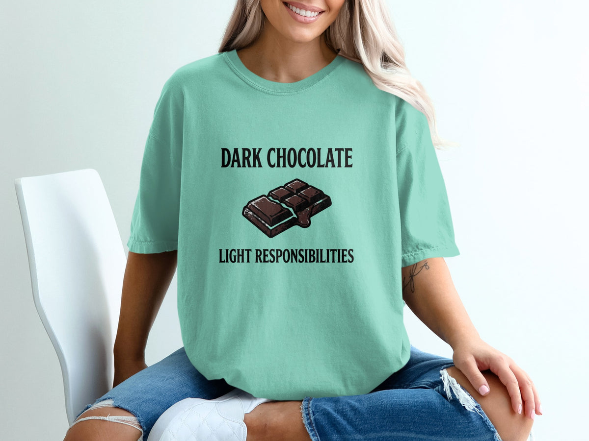 Teal t-shirt with "DARK CHOCOLATE LIGHT RESPONSIBILITIES" text and chocolate bar graphic.