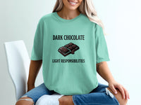 Teal t-shirt with "DARK CHOCOLATE LIGHT RESPONSIBILITIES" text and chocolate bar graphic.