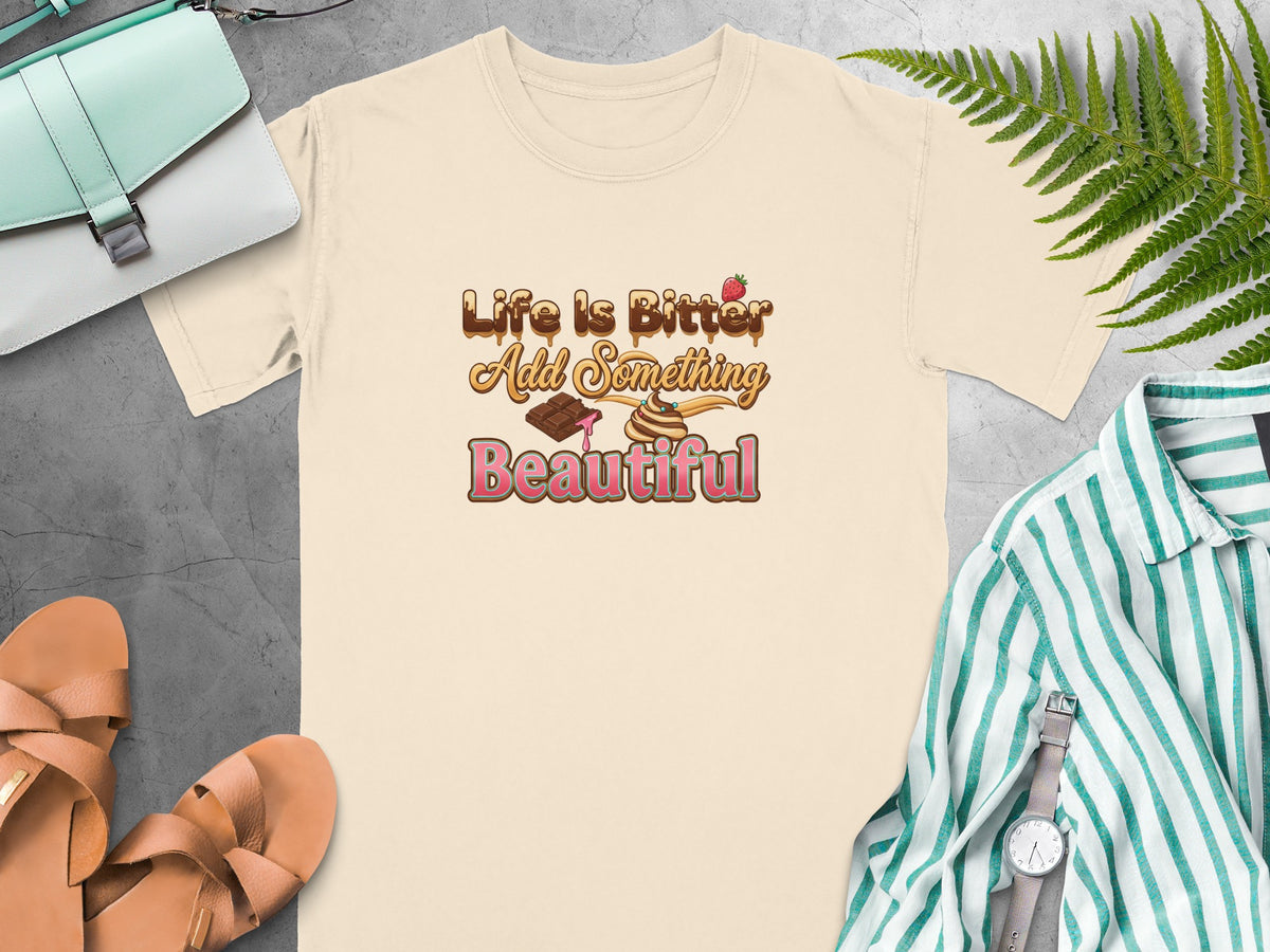 Cream t-shirt with "Life Is Bitter Add Something Beautiful" text and chocolate graphics.