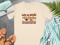 Cream t-shirt with "Life Is Bitter Add Something Beautiful" text and chocolate graphics.