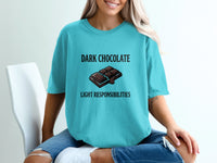 Teal t-shirt with "Dark Chocolate Light Responsibilities" text and chocolate bar graphic.