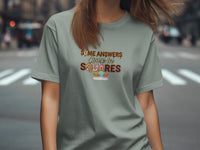 Gray t-shirt with text "SOME ANSWERS Come in SQUARES" and candy.