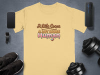 Yellow t-shirt with "A Little Cocoa A LOT MORE Human" text and heart graphic.