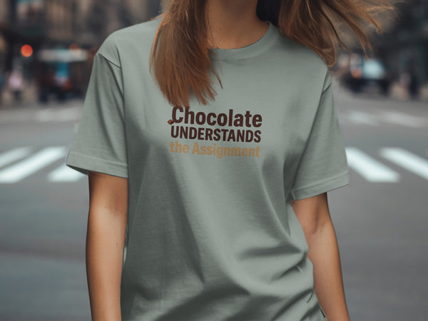 T-shirt with "Chocolate UNDERSTANDS the Assignment" text in brown and tan lettering.