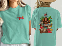 Teal t-shirt with "Cocoa Cabana" on front and monkey eating chocolate graphic on back.