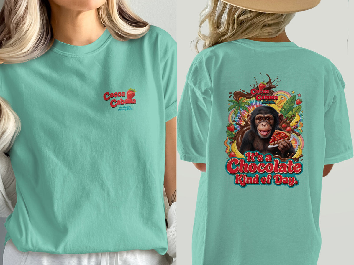 Chimpanzee eating chocolate cake graphic on a teal t-shirt with text.