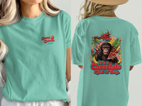 Chimpanzee eating chocolate cake graphic on a teal t-shirt with text.
