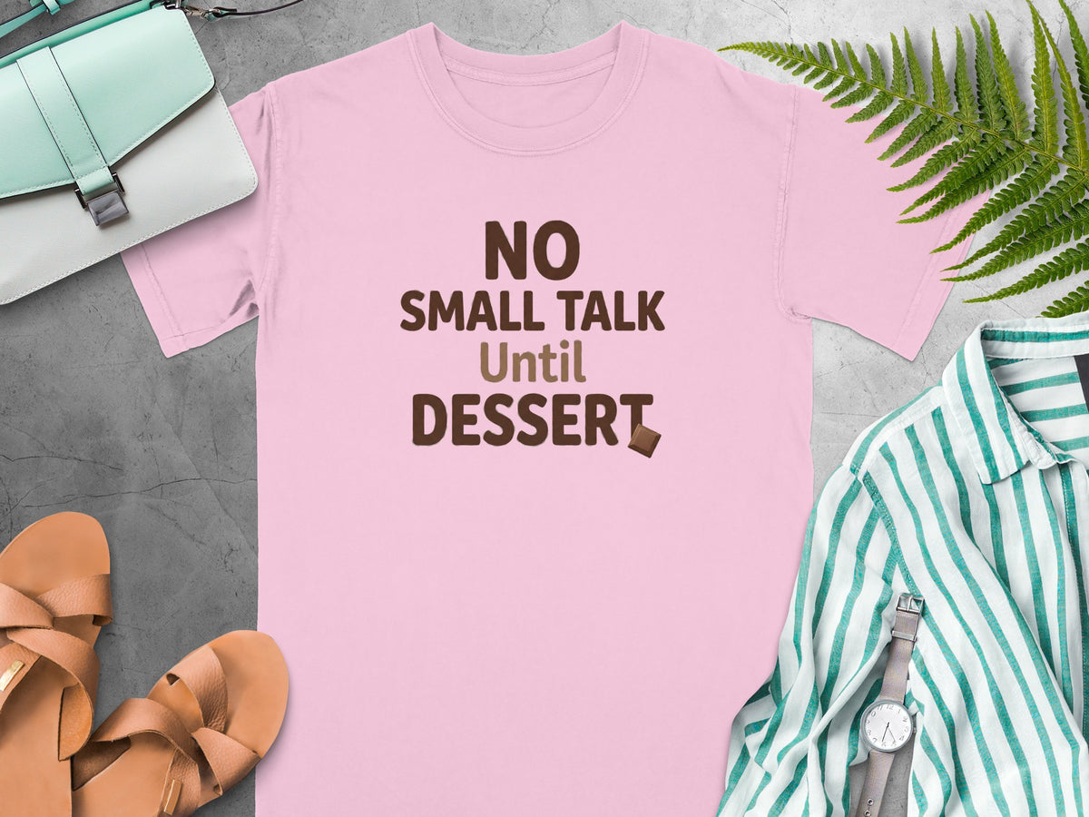 Pink t-shirt with "NO SMALL TALK Until DESSERT" text and chocolate piece.