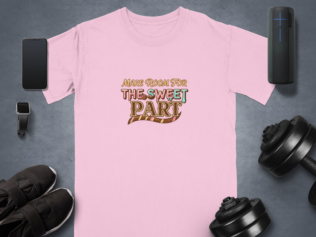 Pink t-shirt with "Make Room for The Sweet Part" text, smartphone, smartwatch, and dumbbells.
