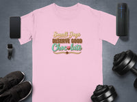 Pink t-shirt with "Small Joys Deserve Good Chocolate" text.