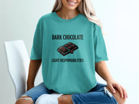 Teal t-shirt with "DARK CHOCOLATE LIGHT RESPONSIBILITIES" text and chocolate bar graphic.
