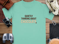 Teal t-shirt with text "QUIETLY THINKING ABOUT CHOCOLATE" and a chocolate bar graphic.