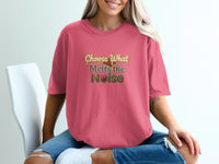 Pink t-shirt with "Choose What Melts the Noise" text and chocolate graphic.