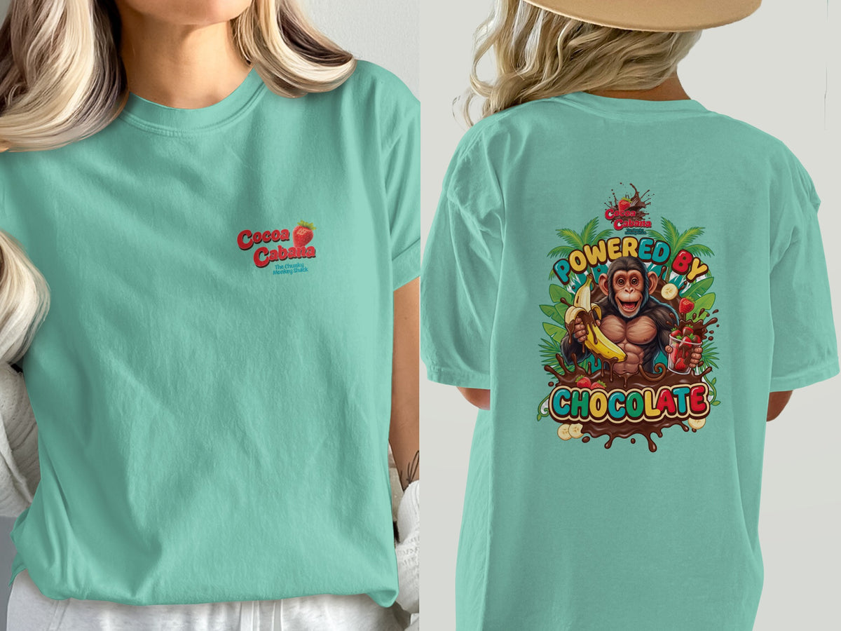 Mint green t-shirt with "Cocoa Cabana" logo and monkey graphic that says "Powered by Chocolate".