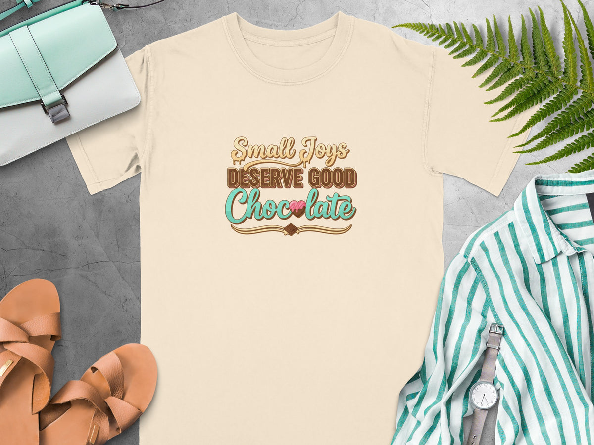 Cream t-shirt with "Small Joys Deserve Good Chocolate" text and chocolate graphic.