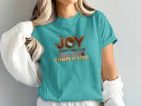 Turquoise t-shirt with "JOY DOESN'T HAVE TO BE COMPLICATED" text design.