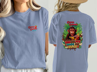 Blue t-shirt with Cocoa Cabana graphic and monkey eating chocolate.