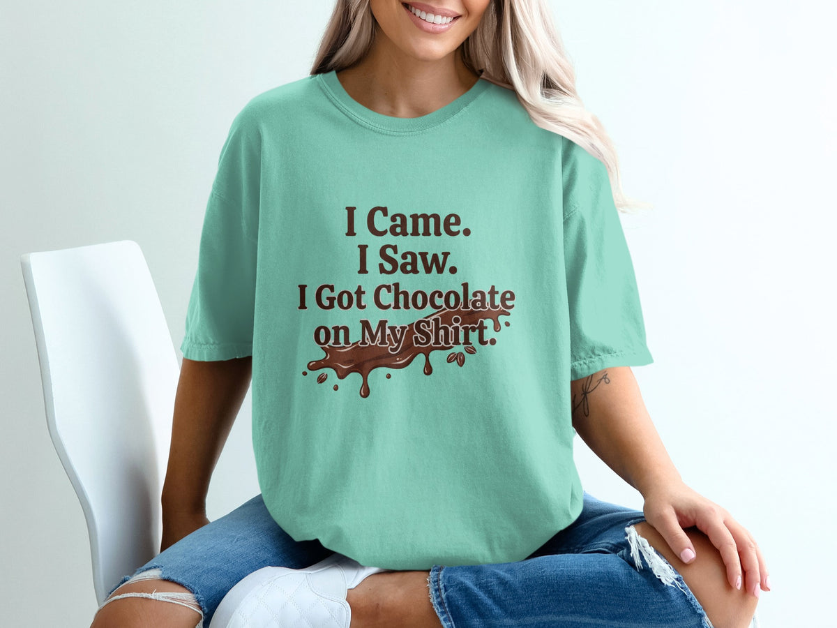 Teal t-shirt with "I Came. I Saw. I Got Chocolate on My Shirt." text.