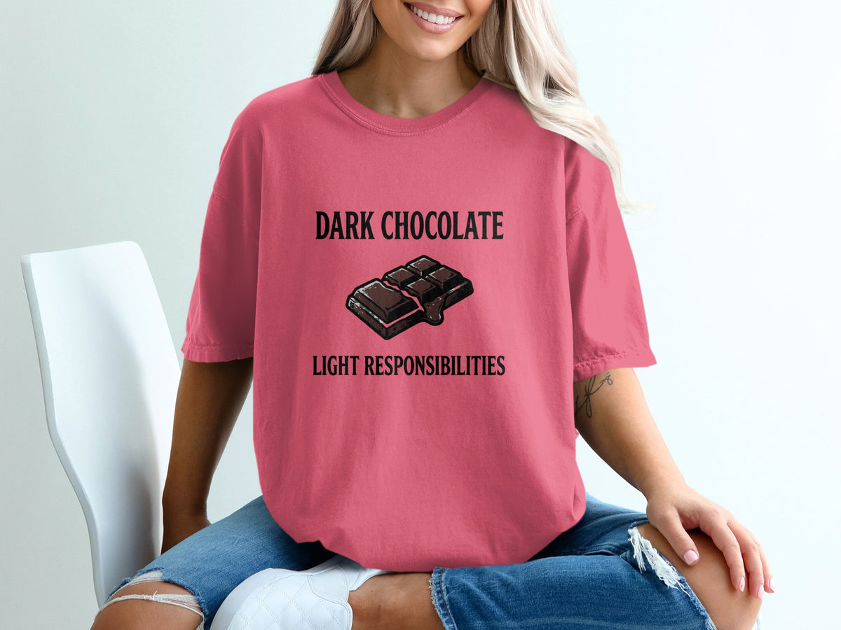 Dark chocolate graphic with text "LIGHT RESPONSIBILITIES" on a pink t-shirt.