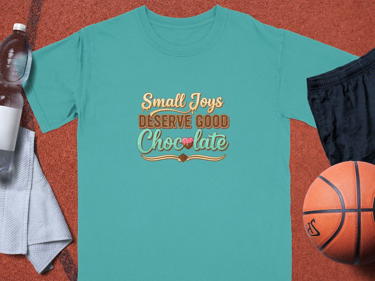Teal t-shirt with "Small Joys Deserve Good Chocolate" text graphic.