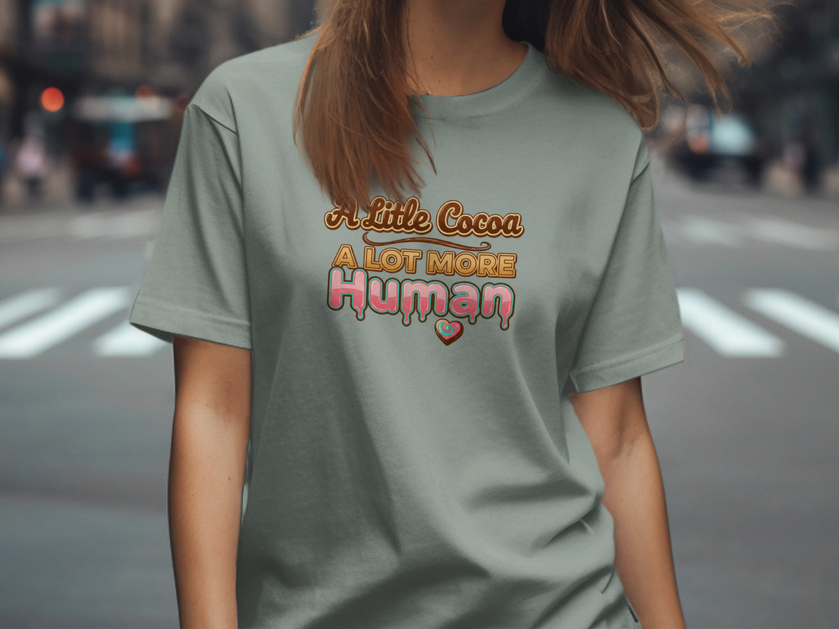 Grey t-shirt with "A Little Cocoa A Lot More Human" text and heart graphic.