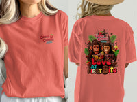 Coral t-shirt with "Cocoa Cabana" logo on front and monkeys with chocolate on back.