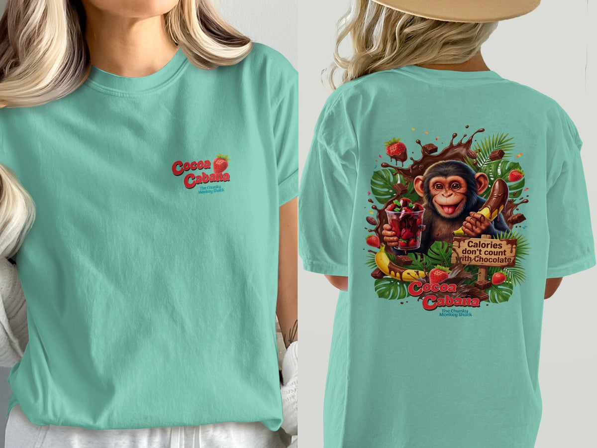 Teal t-shirt with "Cocoa Cabana" logo and monkey with chocolate and fruit graphic.