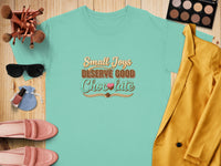 Teal t-shirt with "Small Joys Deserve Good Chocolate" text.