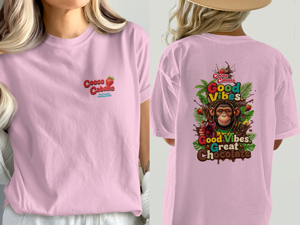 Pink t-shirt with "Cocoa Cabana" and strawberry on front, "Good Vibes Great Chocolate" with monkey on back.
