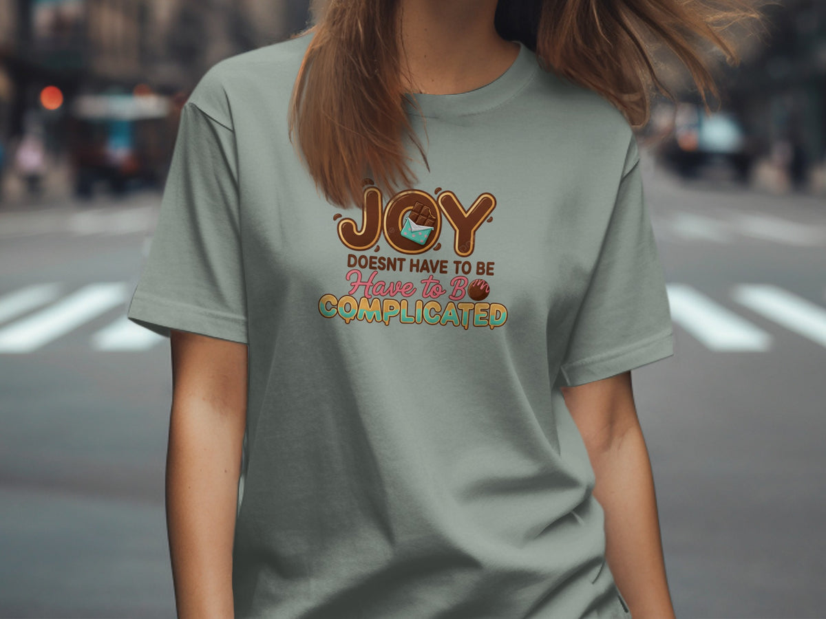 T-shirt with "Joy Doesn't Have to Be Complicated" text and chocolate graphics.