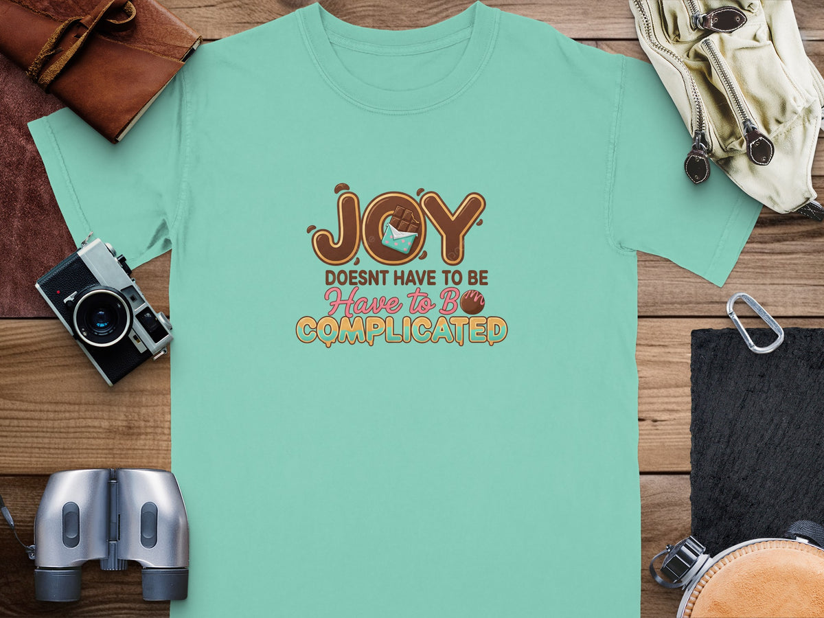 Teal t-shirt with text "JOY DOESNT HAVE TO BE Have to B COMPLICATED".