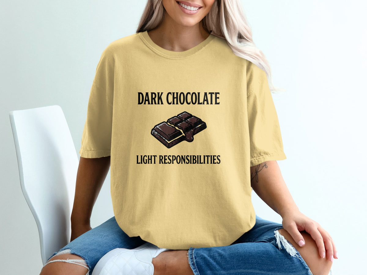 Yellow t-shirt with "DARK CHOCOLATE LIGHT RESPONSIBILITIES" text and chocolate bar graphic.