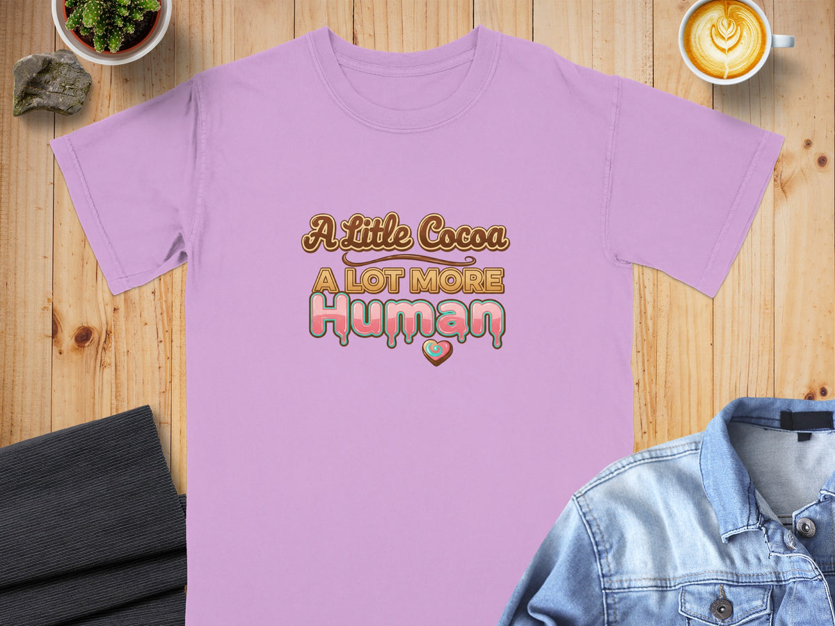 Lavender t-shirt with "A Little Cocoa A Lot More Human" text and a heart graphic.