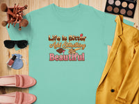 Aqua t-shirt with "Life Is Bitter Add Something Beautiful" text and chocolate illustrations.