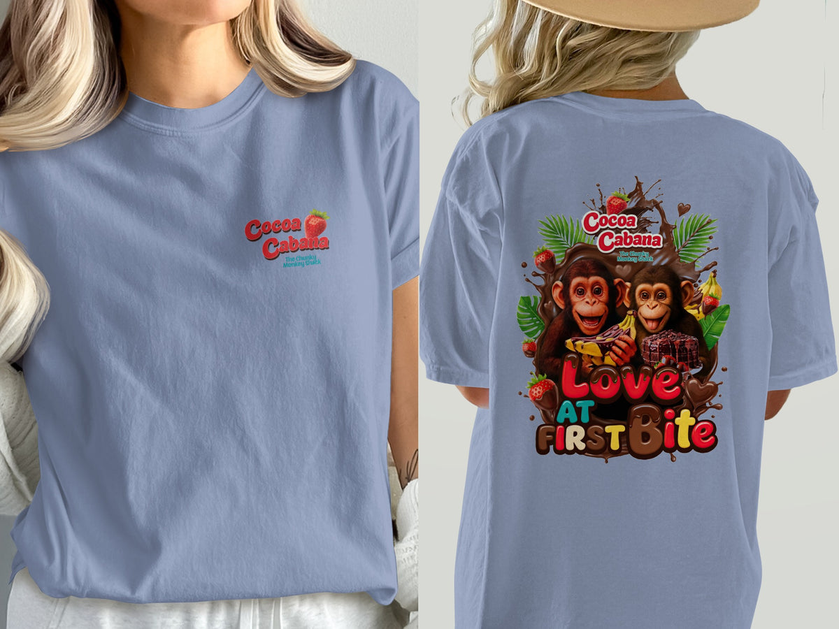 Light blue t-shirt with Cocoa Cabana logo and two monkeys with chocolate and fruit on the back.