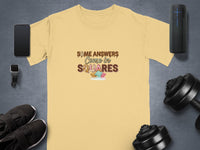 Yellow t-shirt with text "Some Answers Come in Squares" and chocolate squares graphic.