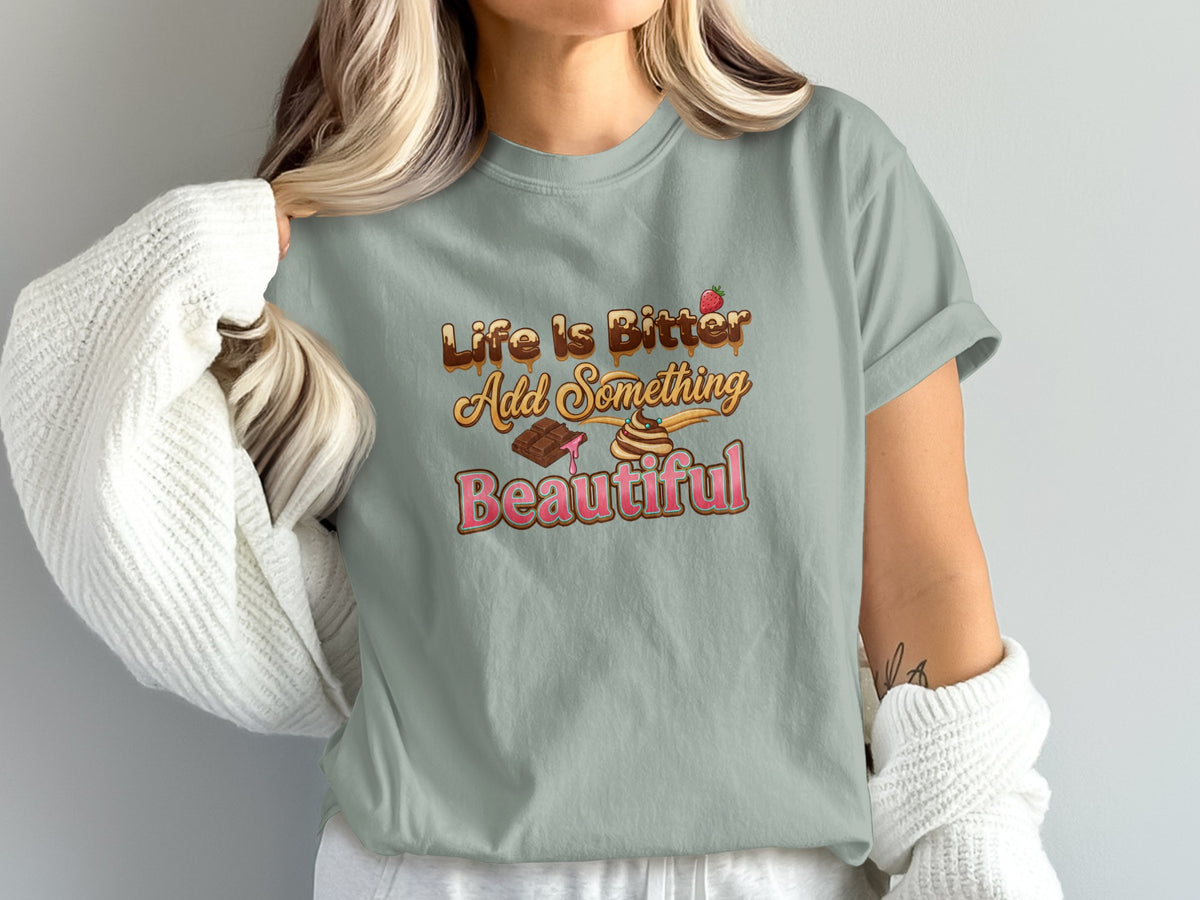 Life is Bitter Add Something Beautiful graphic on a light gray t-shirt.
