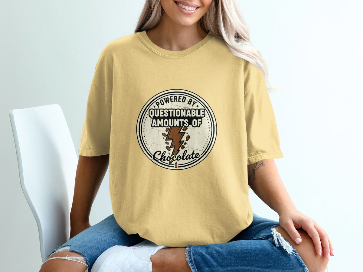 Yellow t-shirt with graphic "Powered by questionable amounts of chocolate"