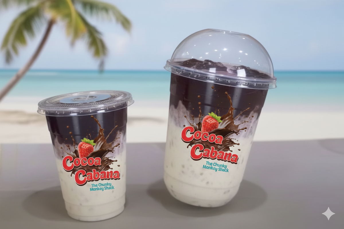 Two Cocoa Cabana drinks on a beach with palm trees and ocean in the background