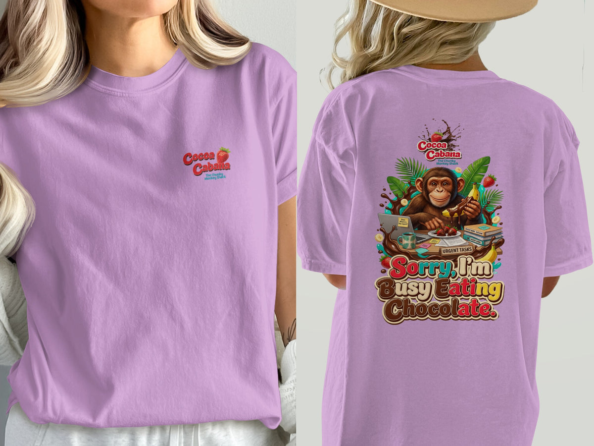 Purple t-shirt with a monkey and the text "Sorry, I'm Busy Eating Chocolate."