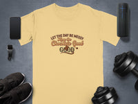Light yellow t-shirt with "Let the day be messy, Keep the Chocolate Good" text.