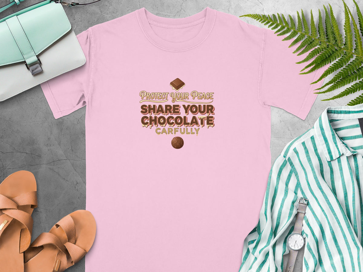 Pink t-shirt with text "Protect Your Peace Share Your Chocolate Carefully" and chocolate graphics.