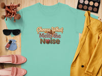 Aqua t-shirt with "Choose What Melts the Noise" graphic and chocolate design.