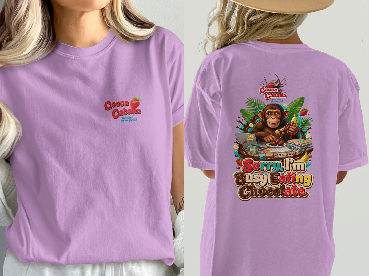 Lavender t-shirt with Cocoa Cabana logo on front and monkey eating chocolate graphic on back.