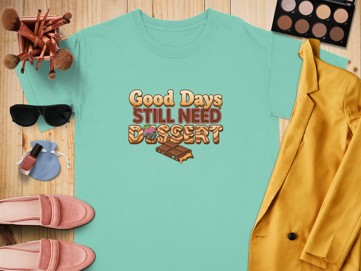 Teal t-shirt with "Good Days Still Need Dessert" text and chocolate graphic.