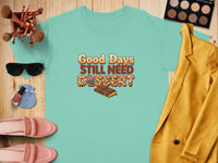 Teal t-shirt with "Good Days Still Need Dessert" text and chocolate graphic.