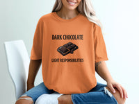 Orange t-shirt with "DARK CHOCOLATE LIGHT RESPONSIBILITIES" text and chocolate bar graphic.
