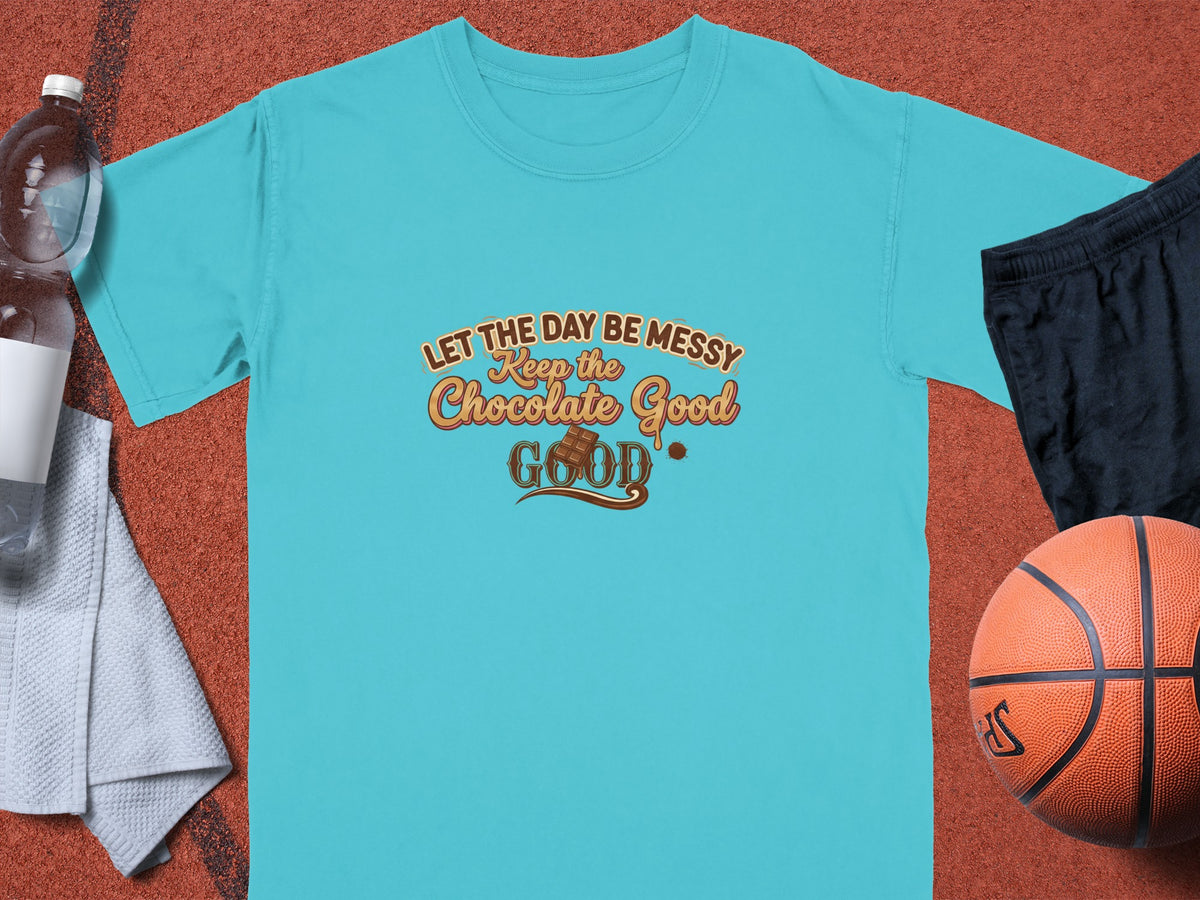 Turquoise t-shirt with "Let the day be messy, keep the chocolate good" text.