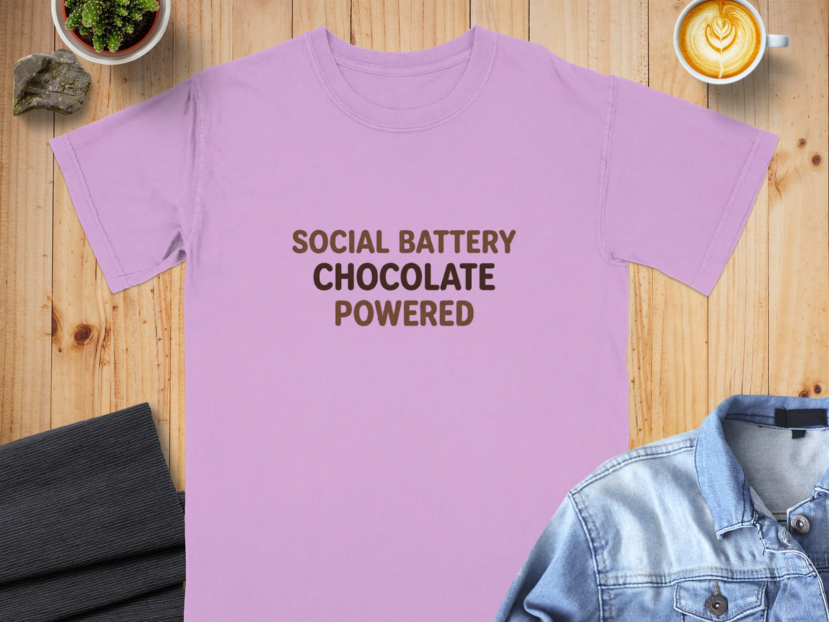 Lavender t-shirt with "Social Battery Chocolate Powered" text.